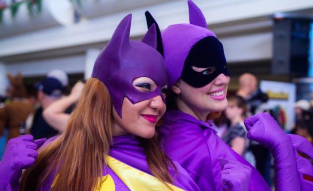 Two fans pose in Batman cosplay at MEGACON Orlando
