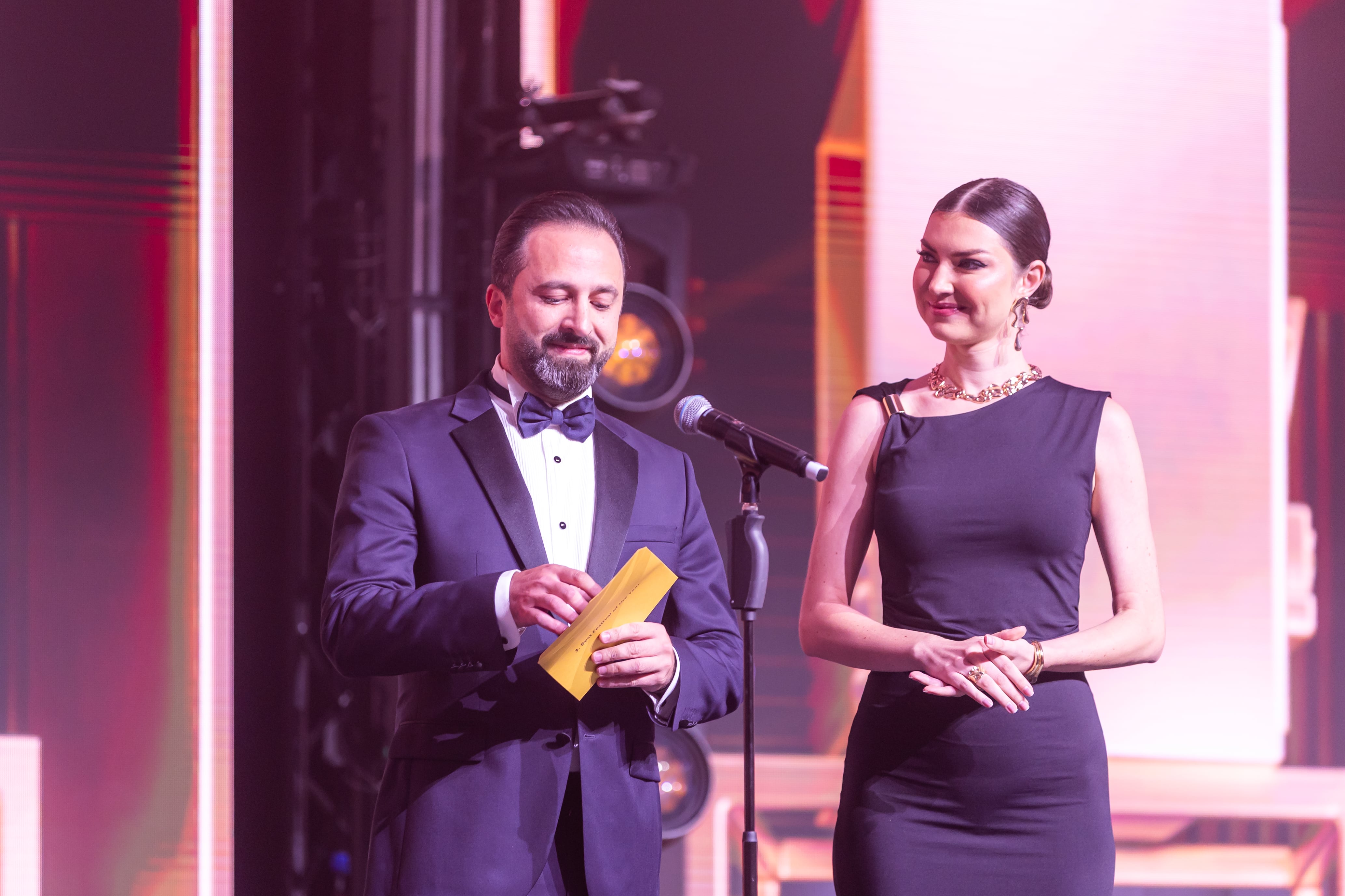 Award presenters on stage at the Middle East Event Awards, with Buildup as presenting sponsor – brand visibility at MEES Awards Ceremony.