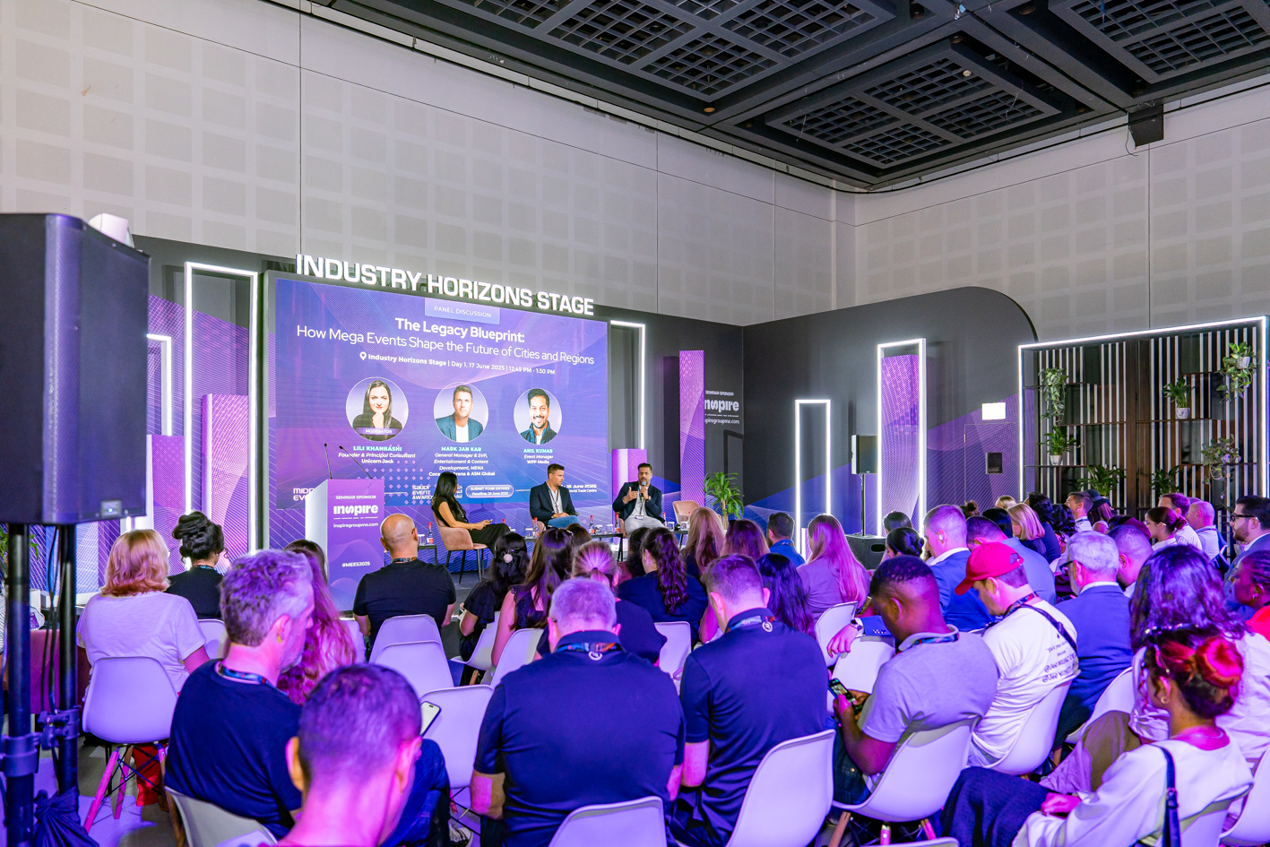 Seminar at the Middle East Event Show, Dubai World Trade Centre (DWTC), with a panel of three speakers on stage discussing 'The Legacy Blueprint: How Mega Events Shape the Future of Cities and Regions,' under the Industry Horizons Stage banner, attended by a seated audience in a modern conference hall.