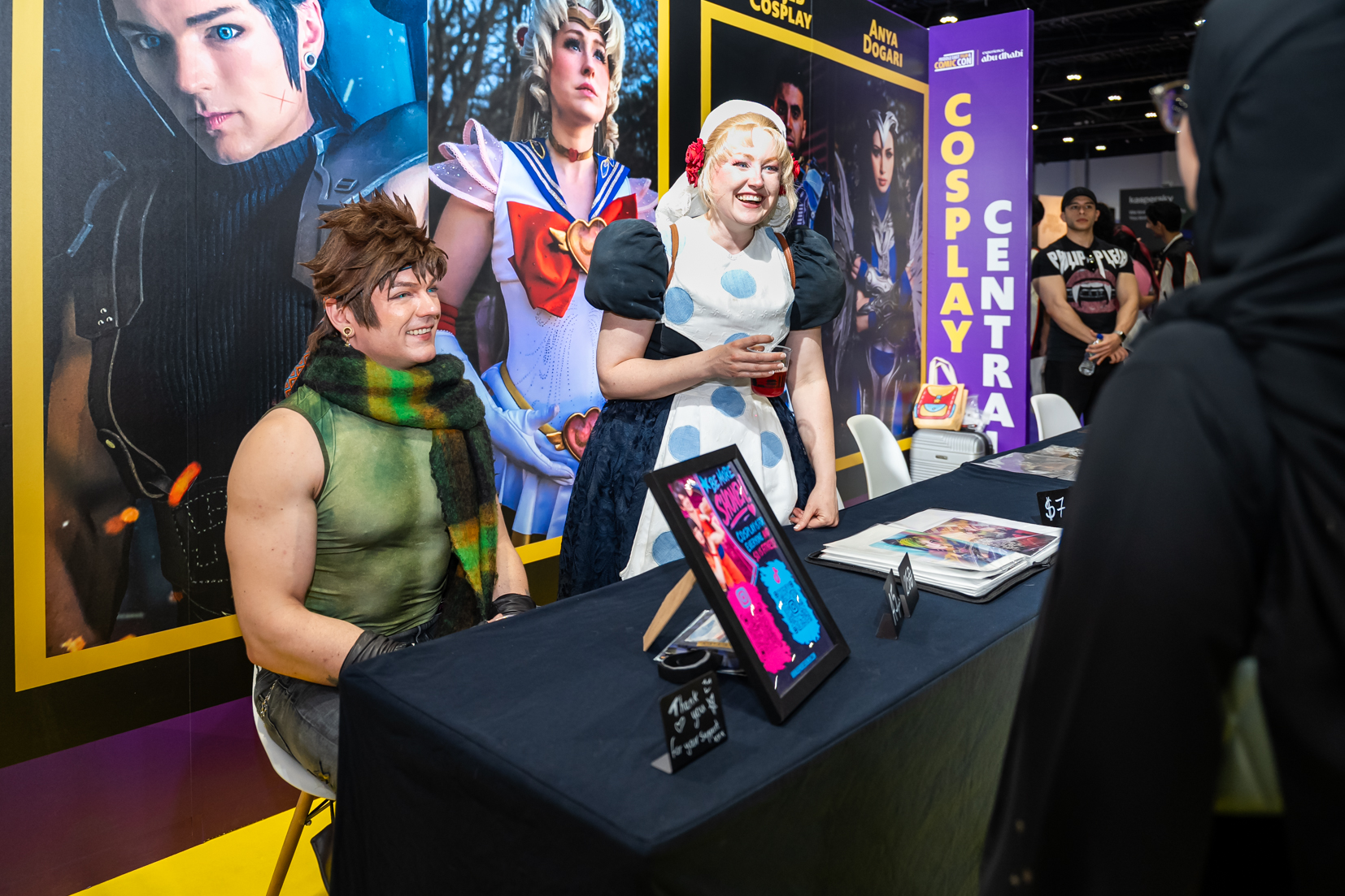 Three fans dressed as the Joker pose together at MEFCC during the Cosplay Meetups, celebrating pop culture and community connection.