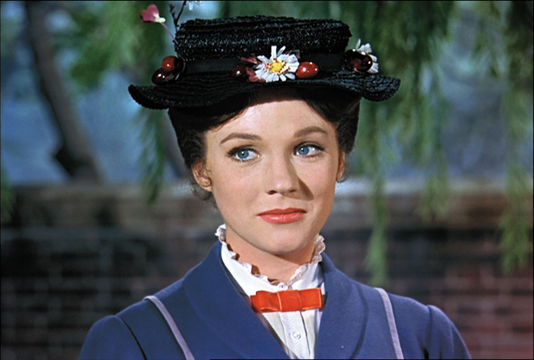 Julie Andrews as Mary Poppins in her classic attire