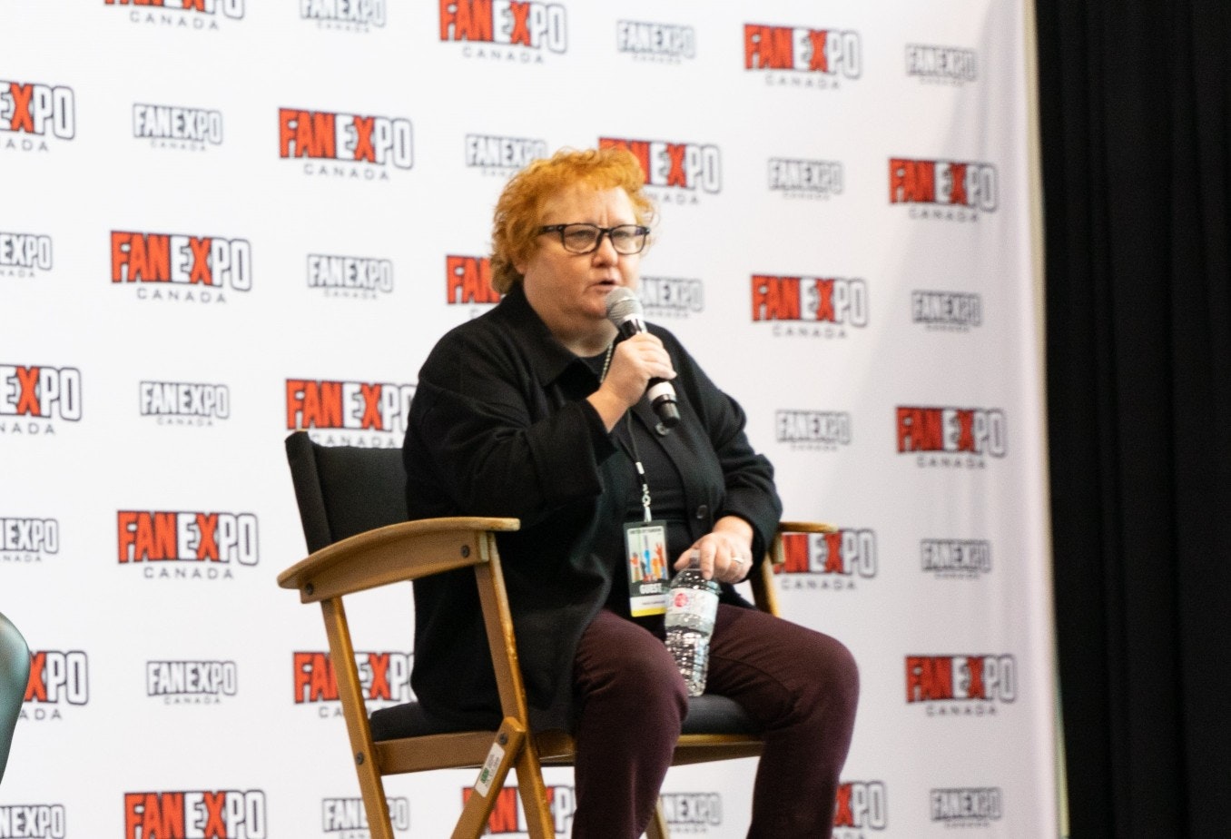 Maile Flanagan answers a question while sitting on stage