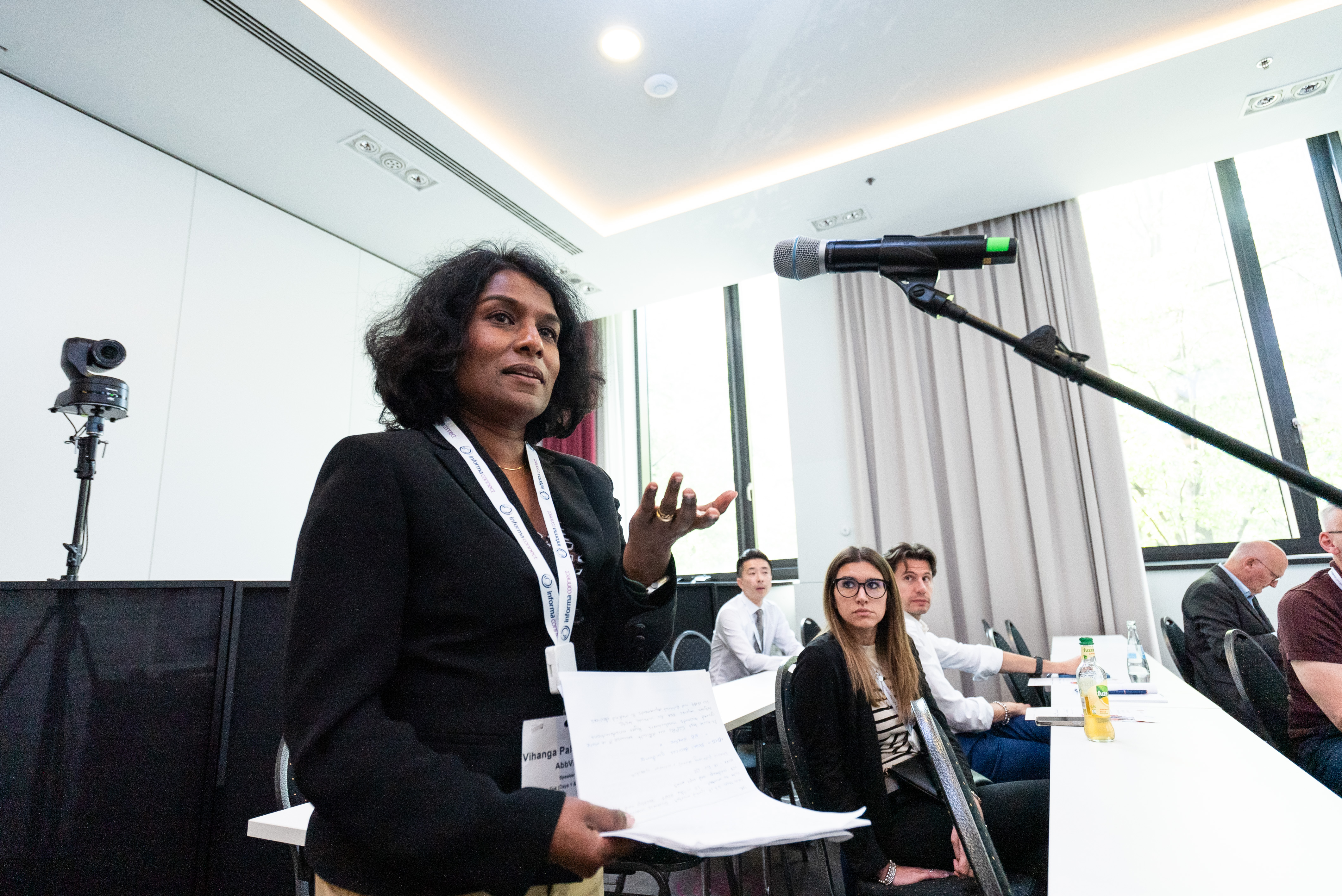 Attendee sharing valuable insights during the sessions.