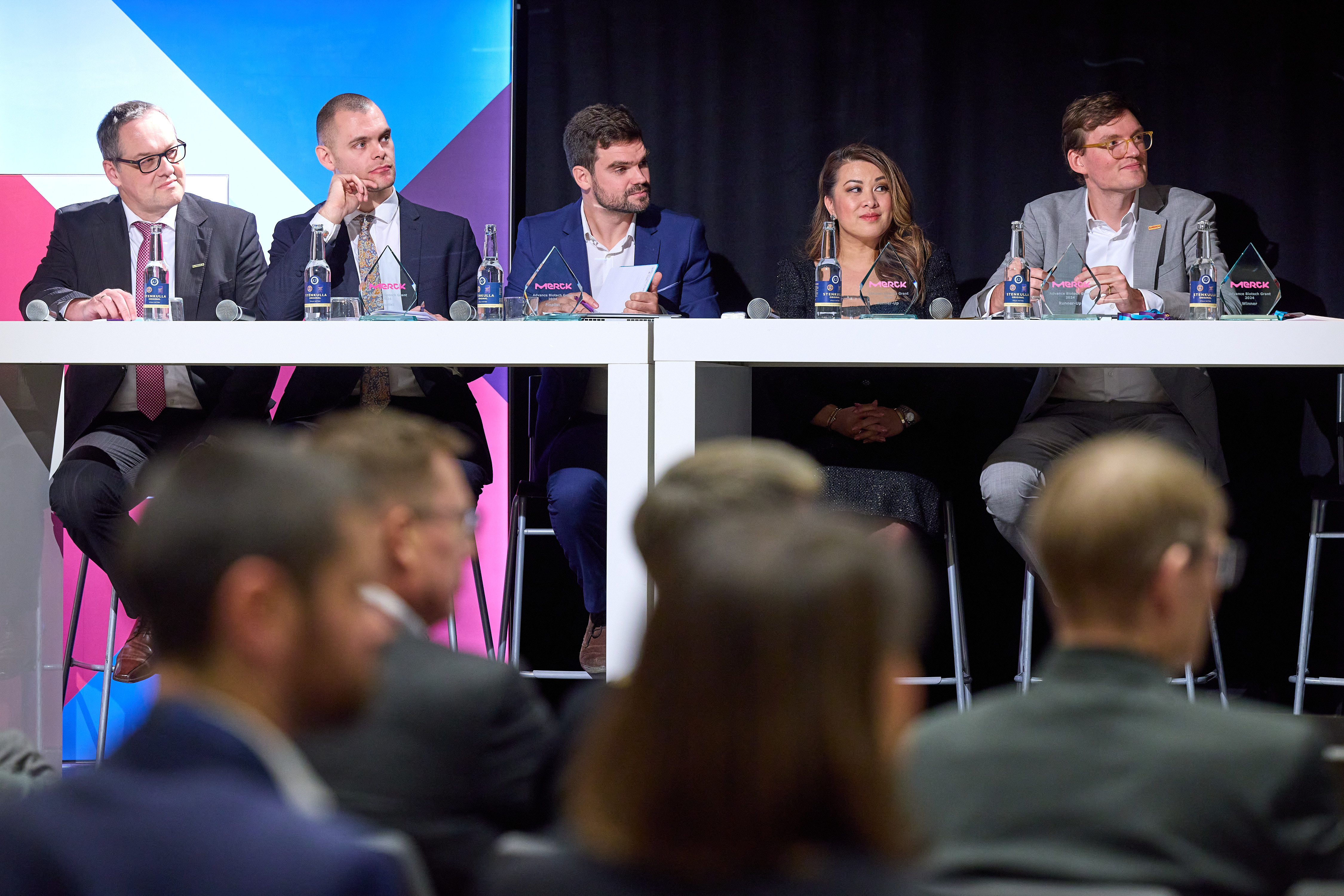 panel of judges sitting on the stage
