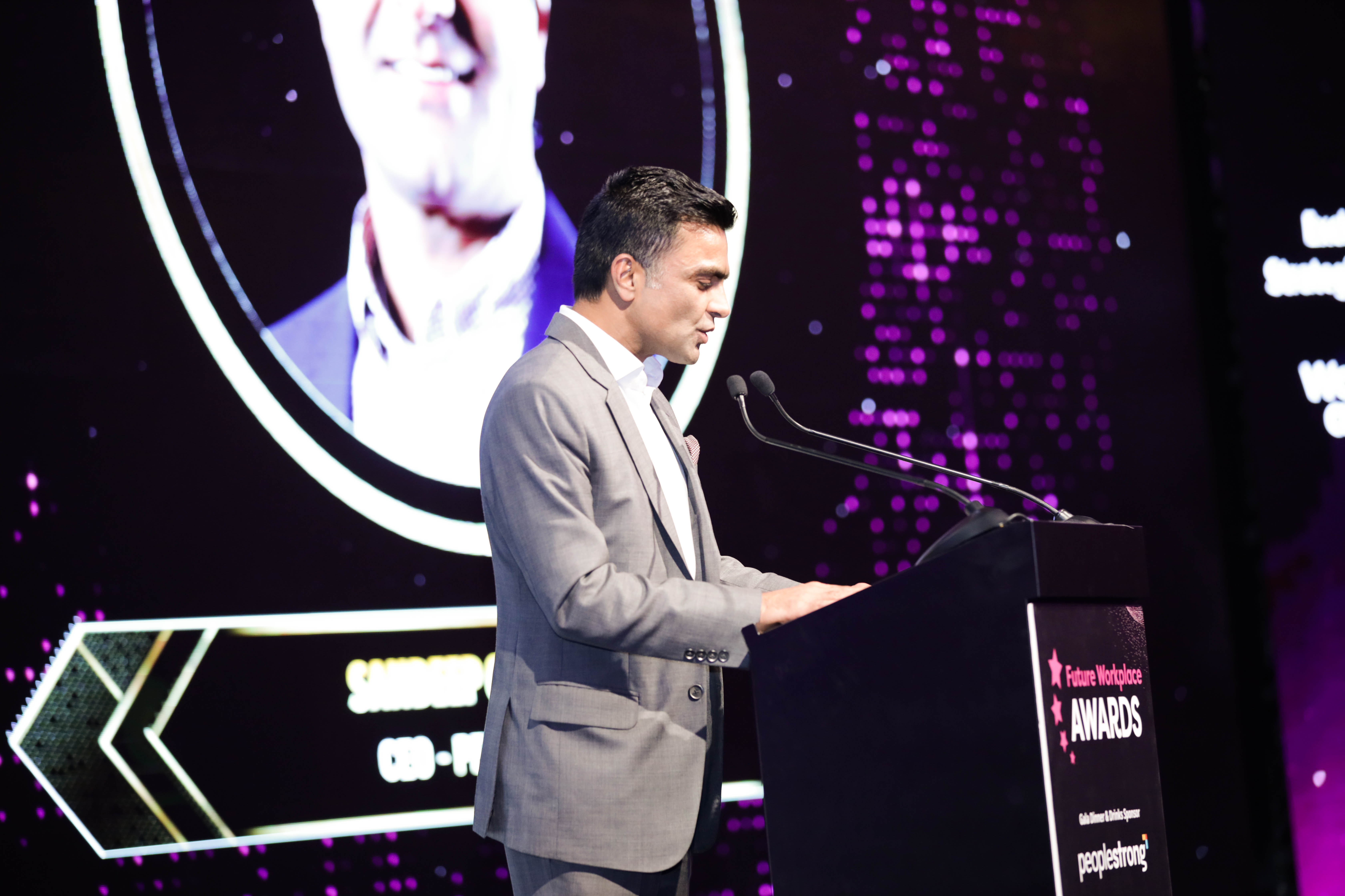 Speaker presenting on stage at the HRSE KSA Awards — recognising HR excellence and honouring teams for their contributions to workplace success