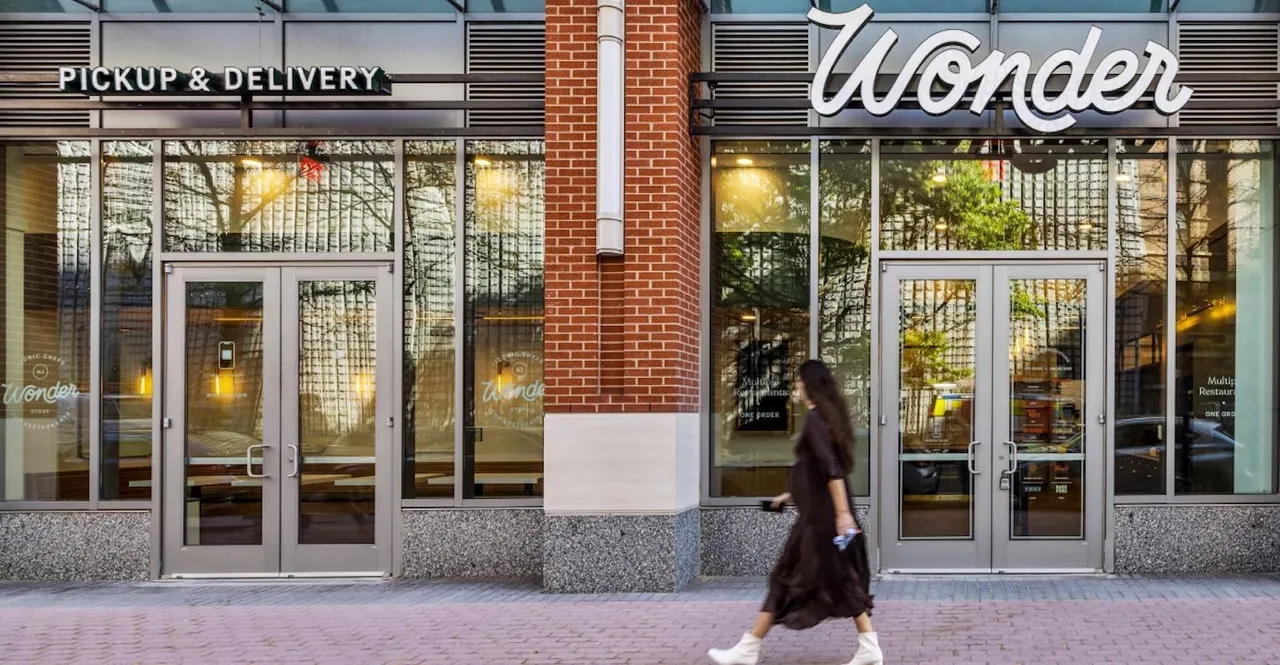A woman walks past the Wonder storefront