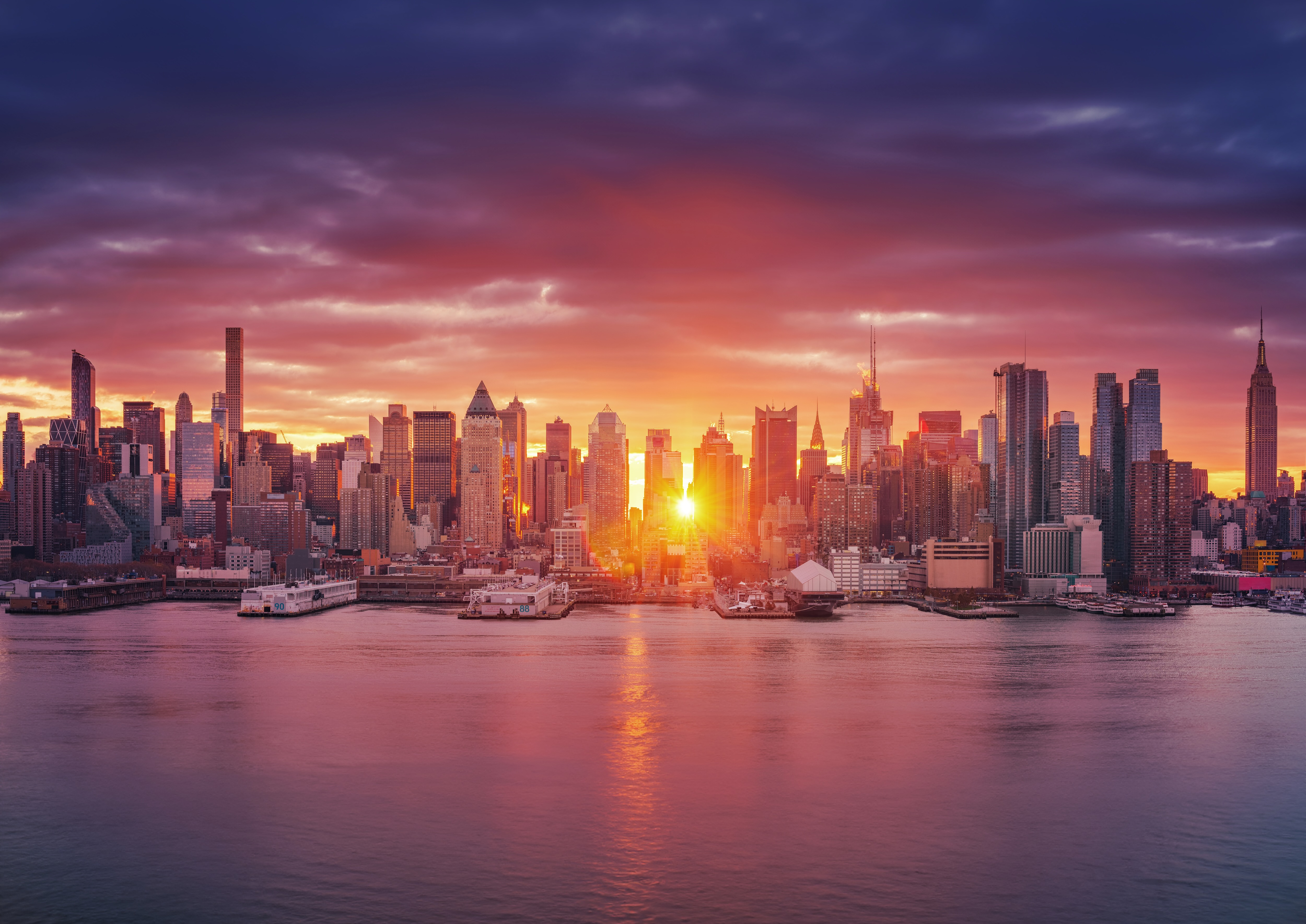 The New York City skyline at sunset.
