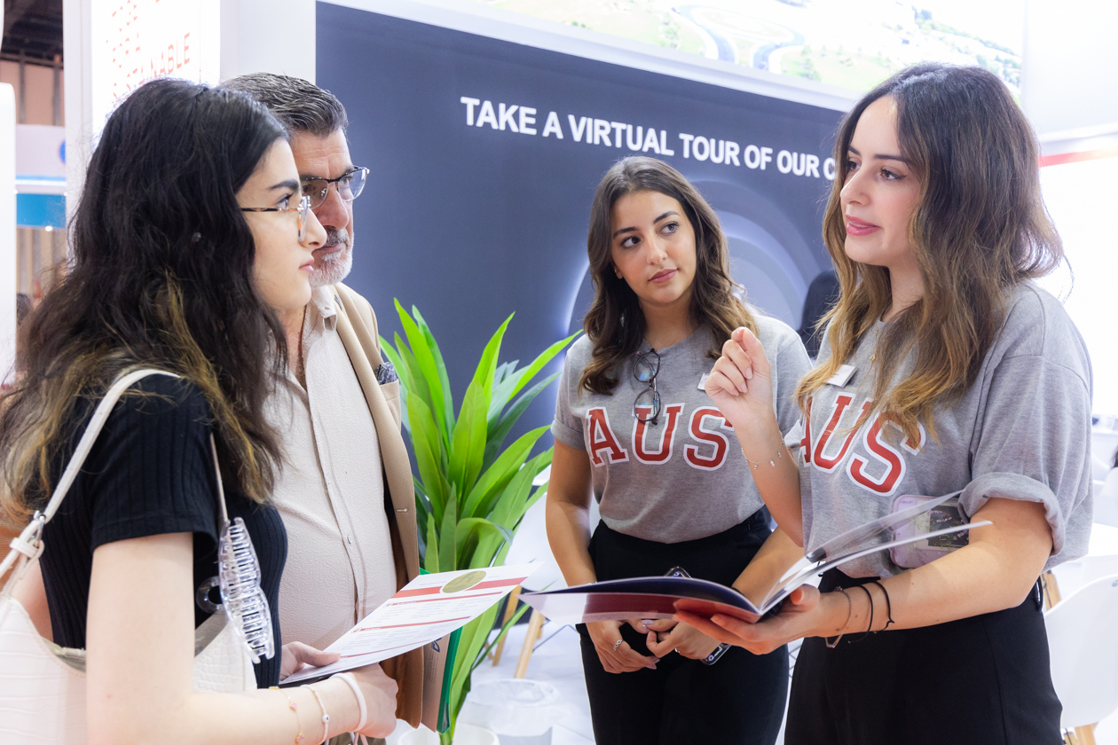 Students engage with American University of Sharjah representatives about programmes and scholarships at Najah Abu Dhabi fair.