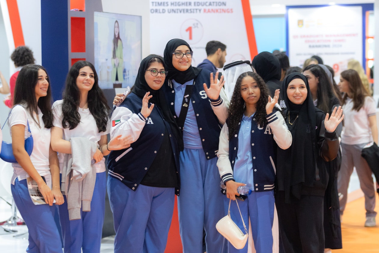 School group of students pose at Najah Abu Dhabi, UAE’s international higher education and study abroad exhibition.