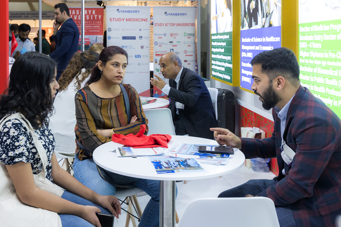 Student receives admissions guidance from university counsellor during Najah Dubai education exhibition in Dubai.