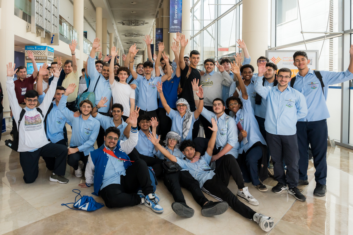 School group poses together at Najah Dubai, UAE’s largest education event for students, parents, and teachers.