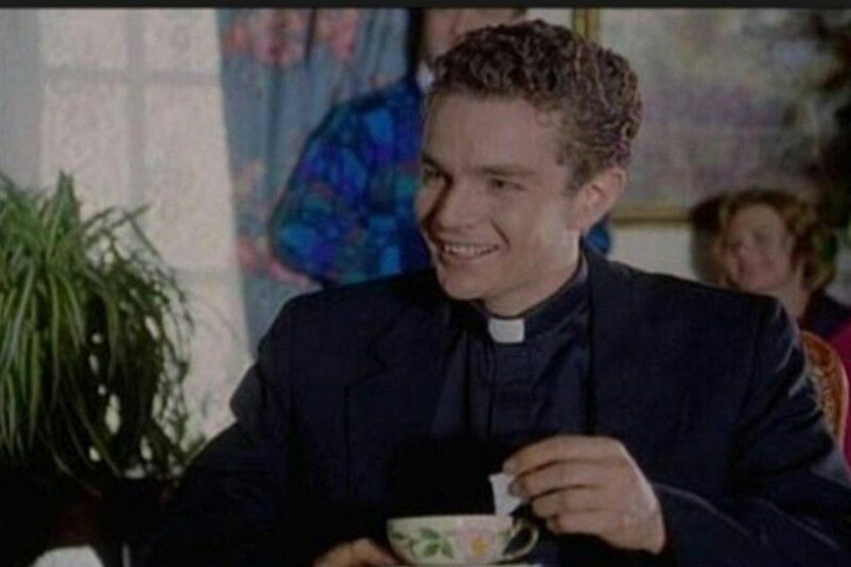 James Marsters in a Reverand outfit drinking tea