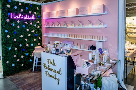 This is an example of Exhibitor provided hardwalls being decorated to create a different aesthetic