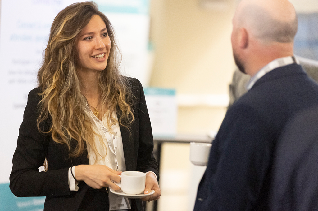 Real estate conference attendees exchanging contact info
