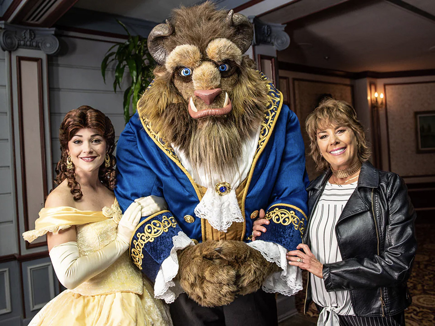 Paige O'Hara with Belle & Beast costumed performers