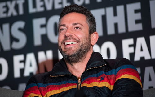 Zachary Levi smiling on stage