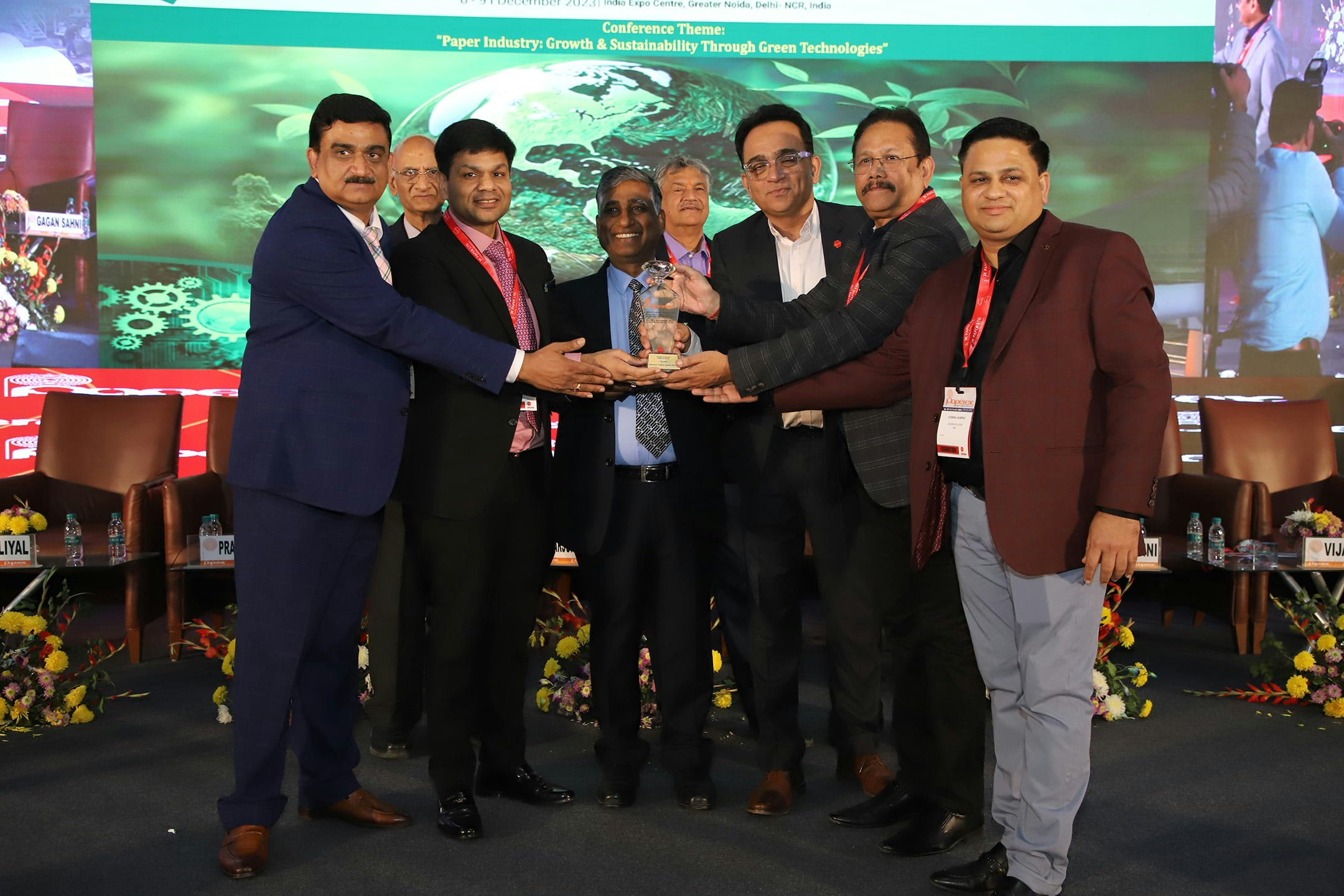 Group of people celebrating after winning an award.