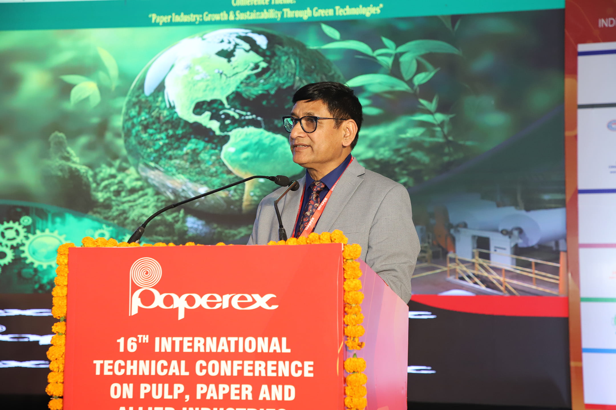 Person speaking at a podium during the award ceremony.