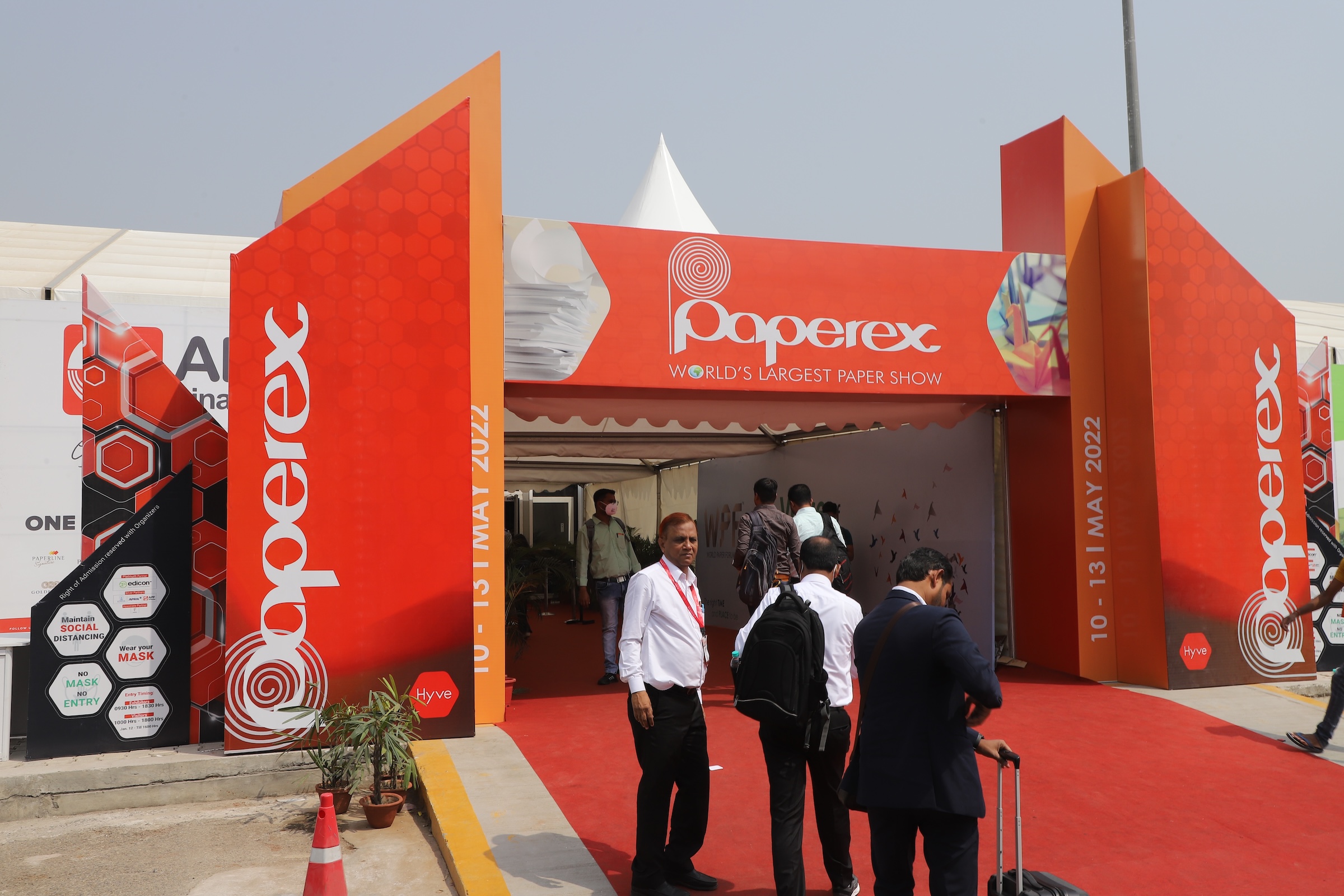 Attendees entering through the main entrance at Paperex
