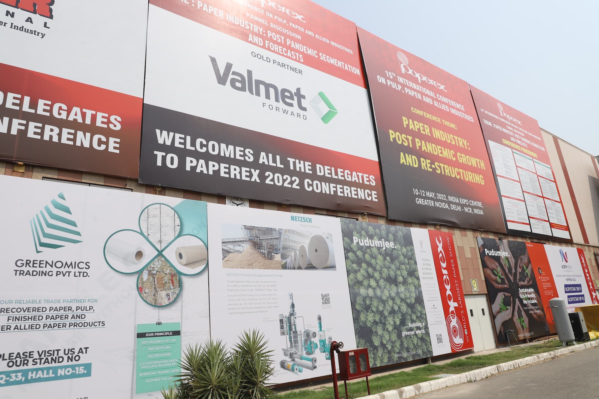 Outdoor billboards installed on the outskirts of the venue featuring event branding and sponsor logos