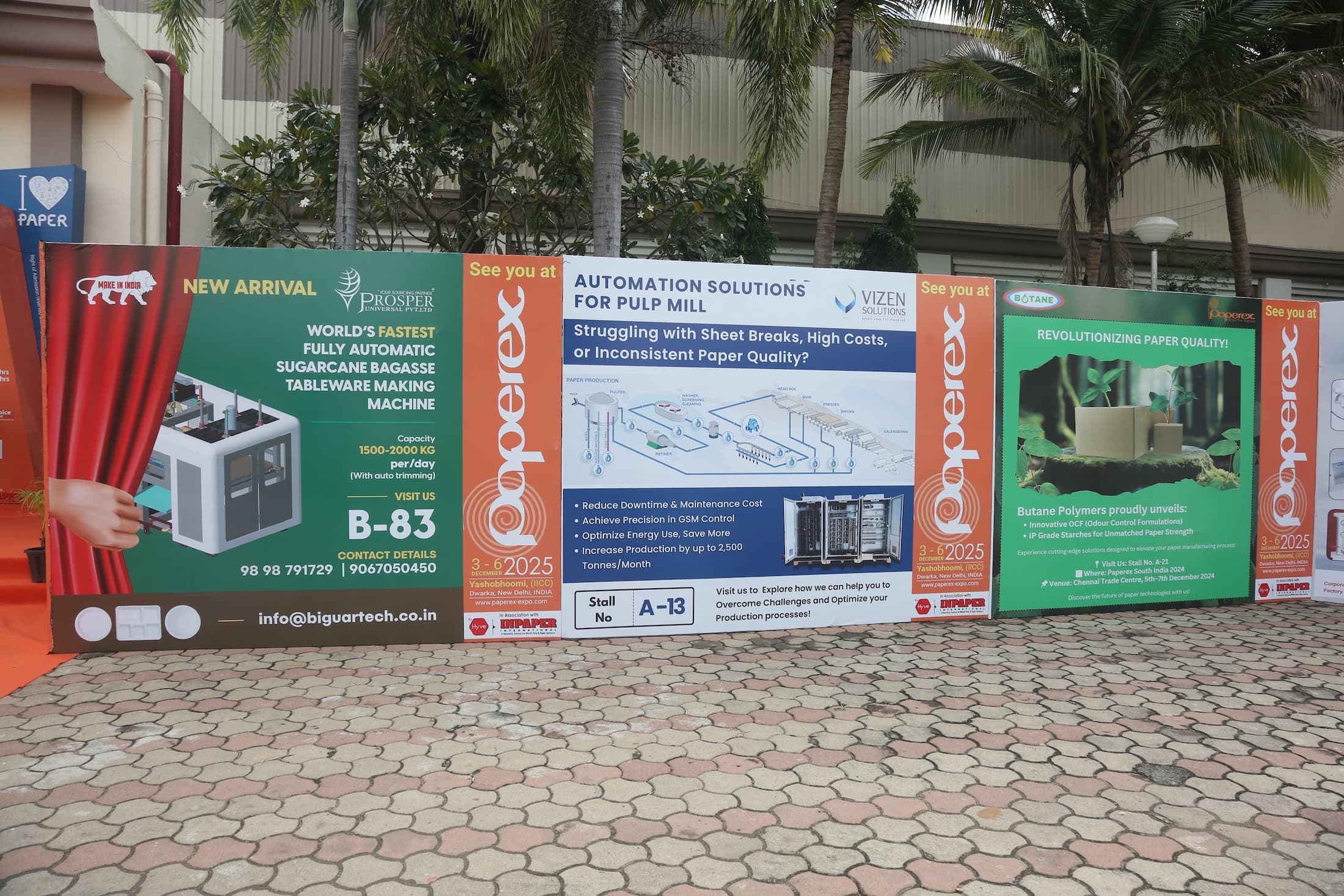 Trade show banners showcasing industrial machinery and automation solutions at Paperex South India.