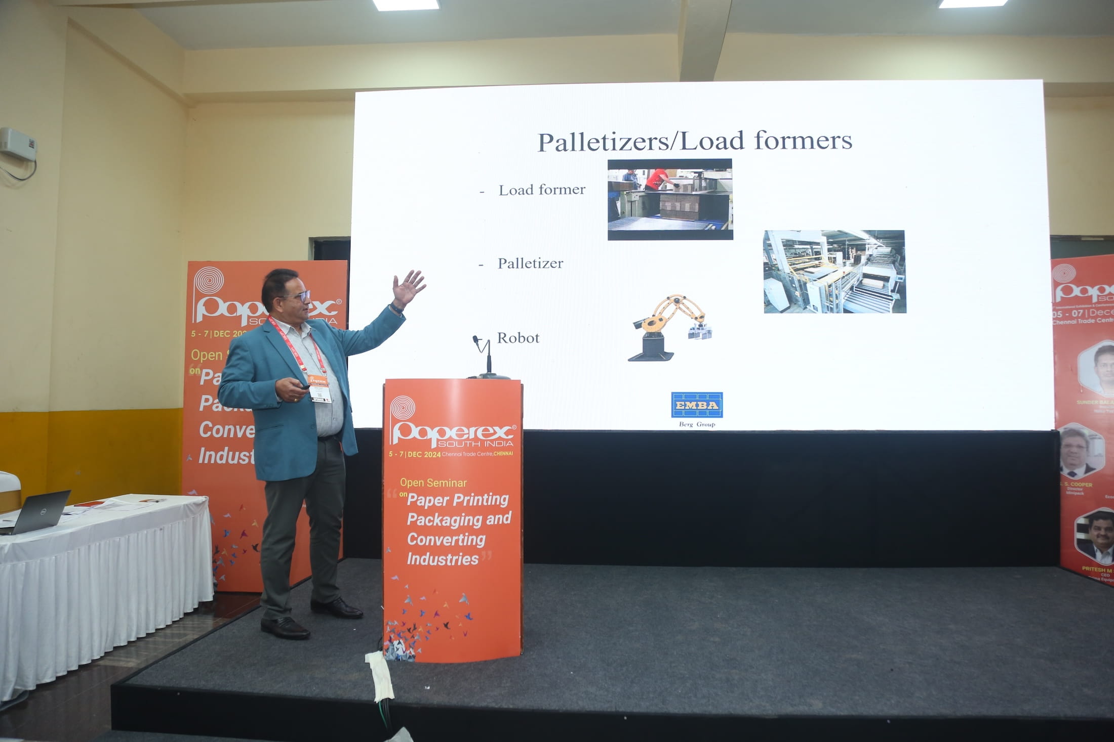 Presenter delivering a technical session on palletizers and load formers during an industry seminar at Paperex South India.