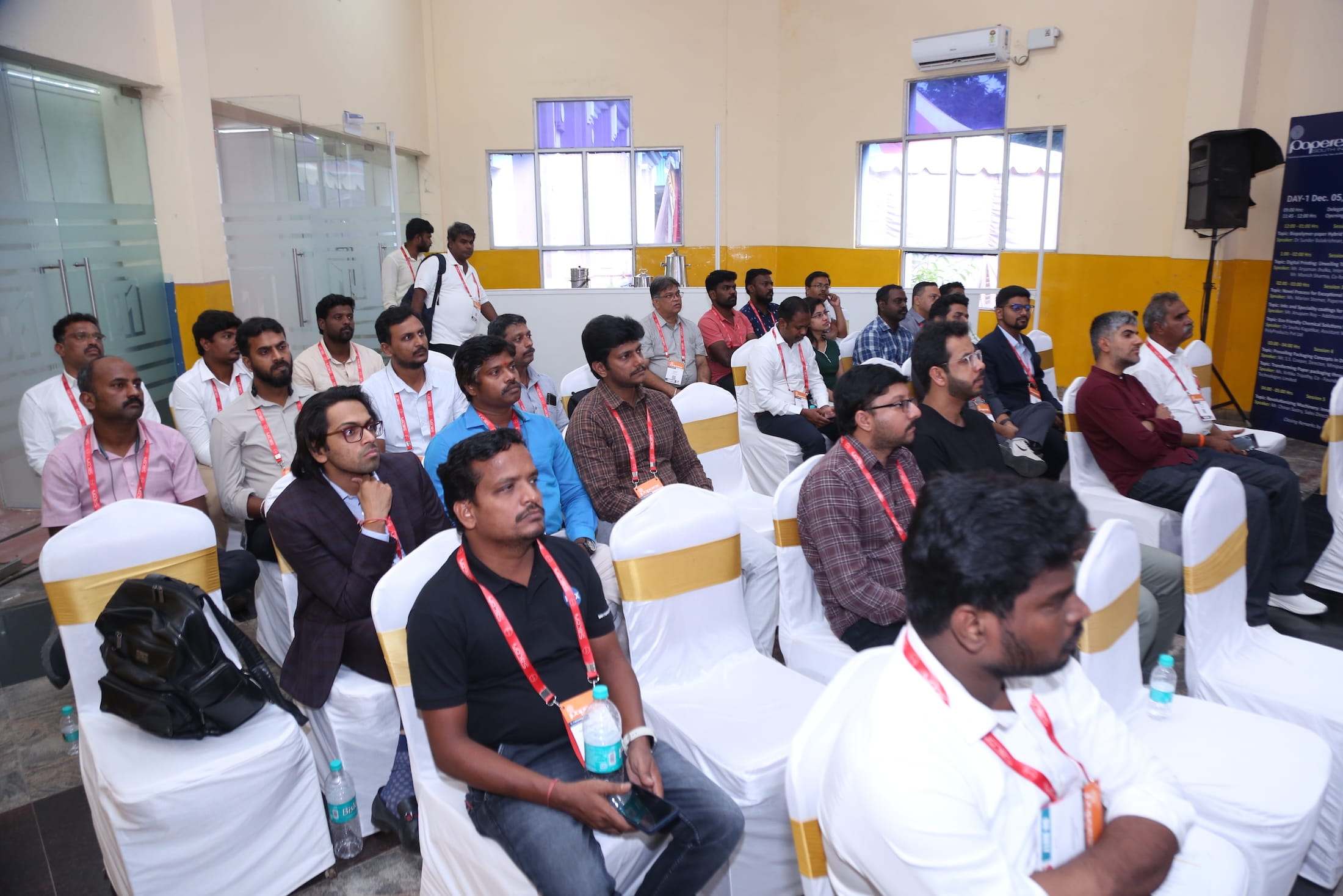 Attendees seated and listening during a conference or seminar at Paperex South India.