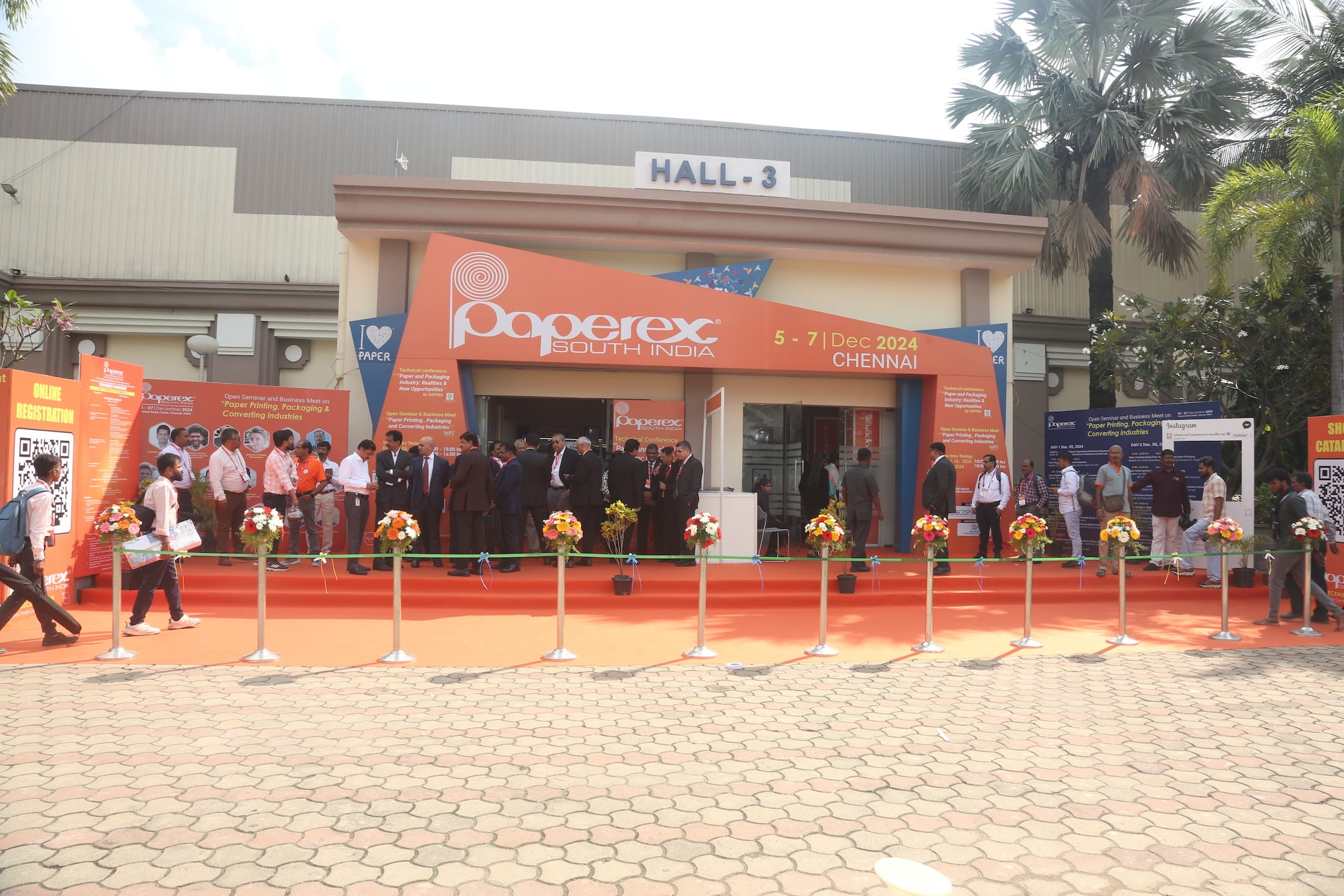 Entrance to Paperex South India at Hall 3, with a red carpet and attendees arriving for the exhibition.