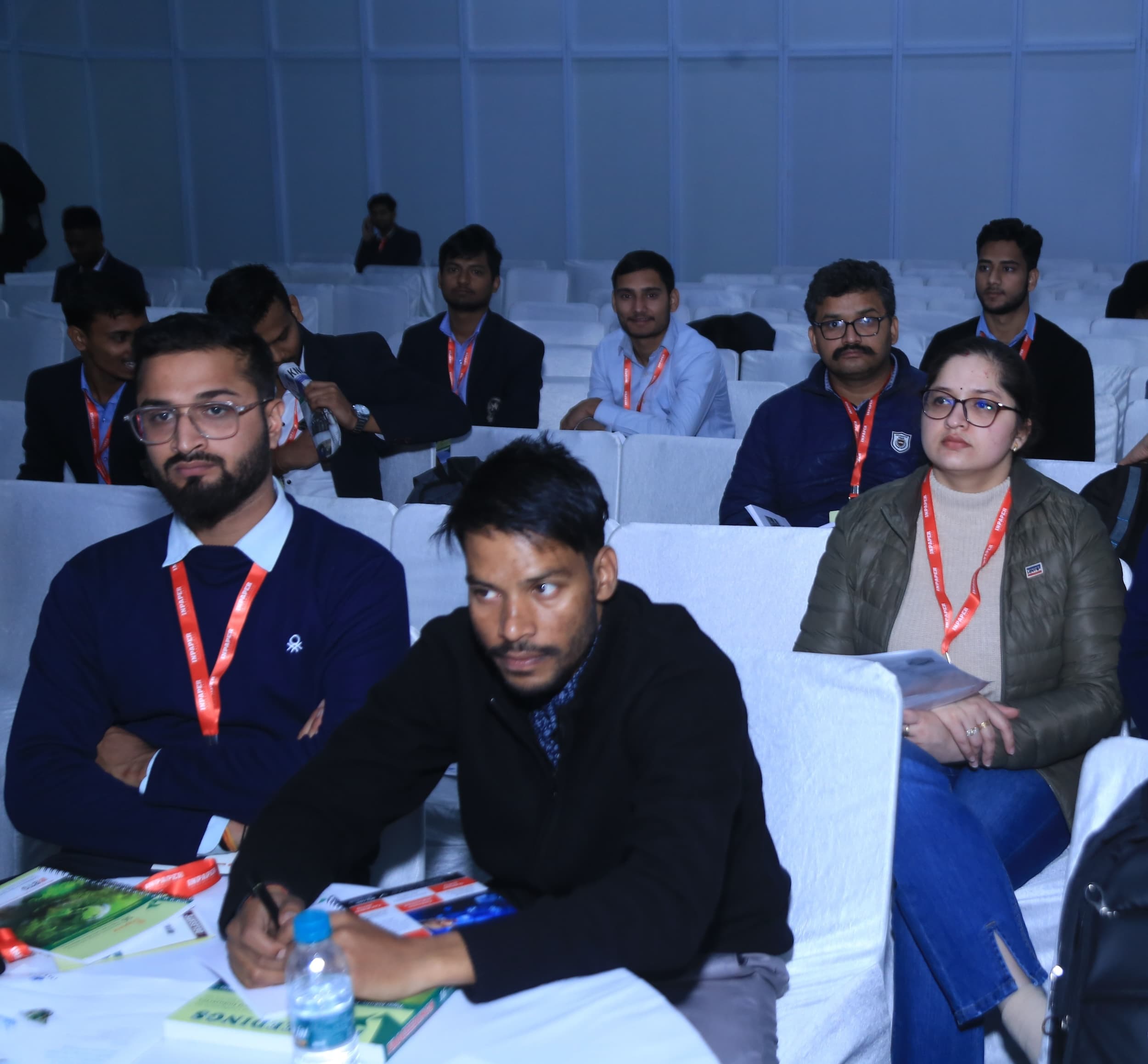 Attendees seated in rows at a conference or seminar event.