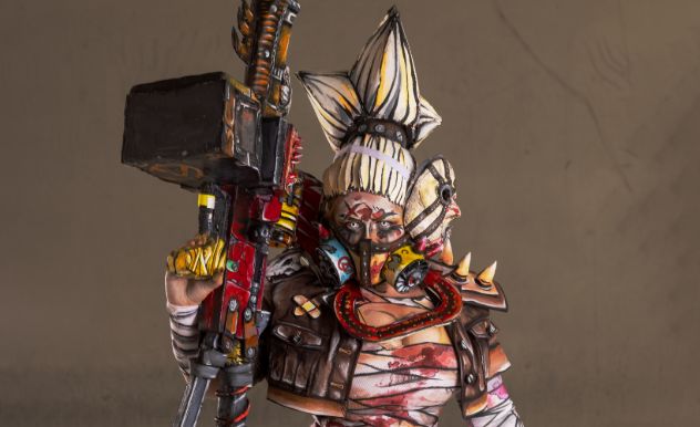 Emma Rubini in cosplay with a solid brown background