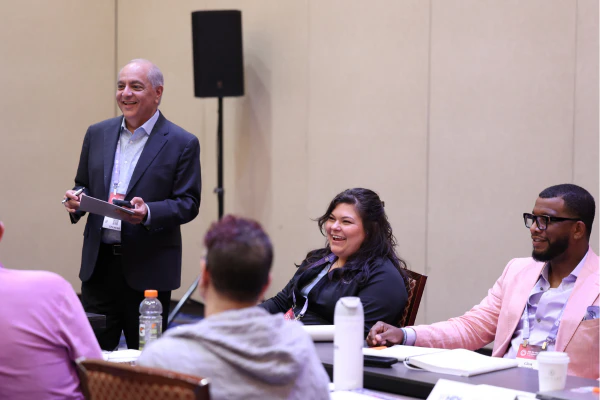 An HDI instructor engages with certification students during a hands-on training course designed to build practical skills and professional expertise.