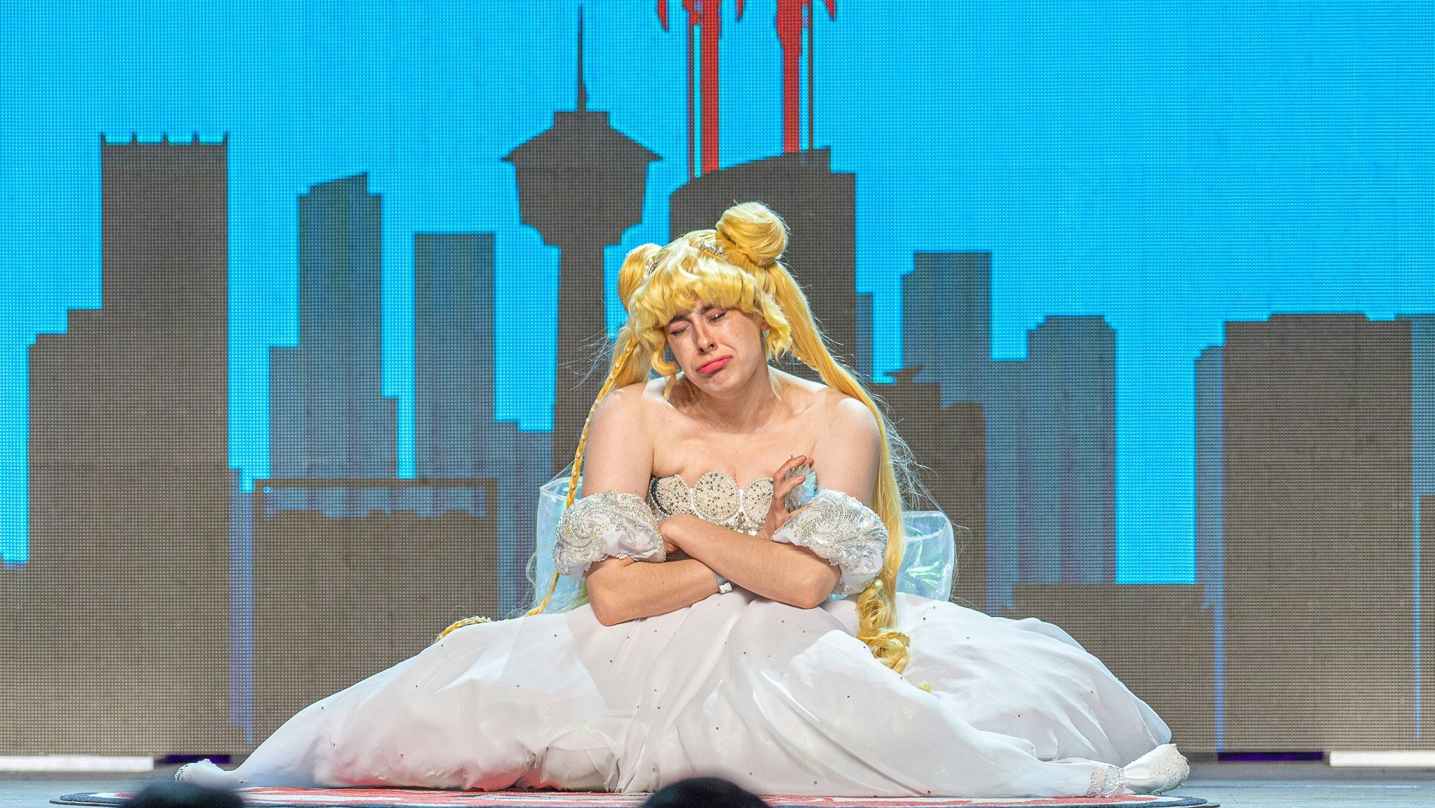 A princess serenity from Sailor Moon cosplayer cries on stage.