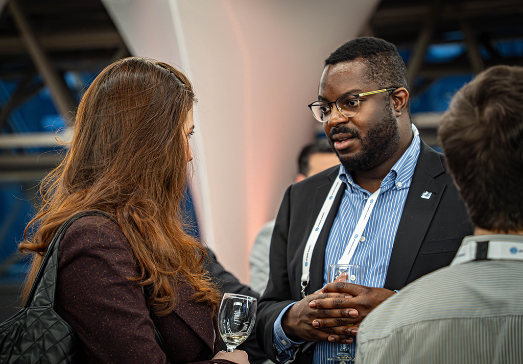 Attendees connecting at the cocktail reception