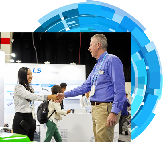 an Exhibitor is shaking hands with an attendee on the expo hall