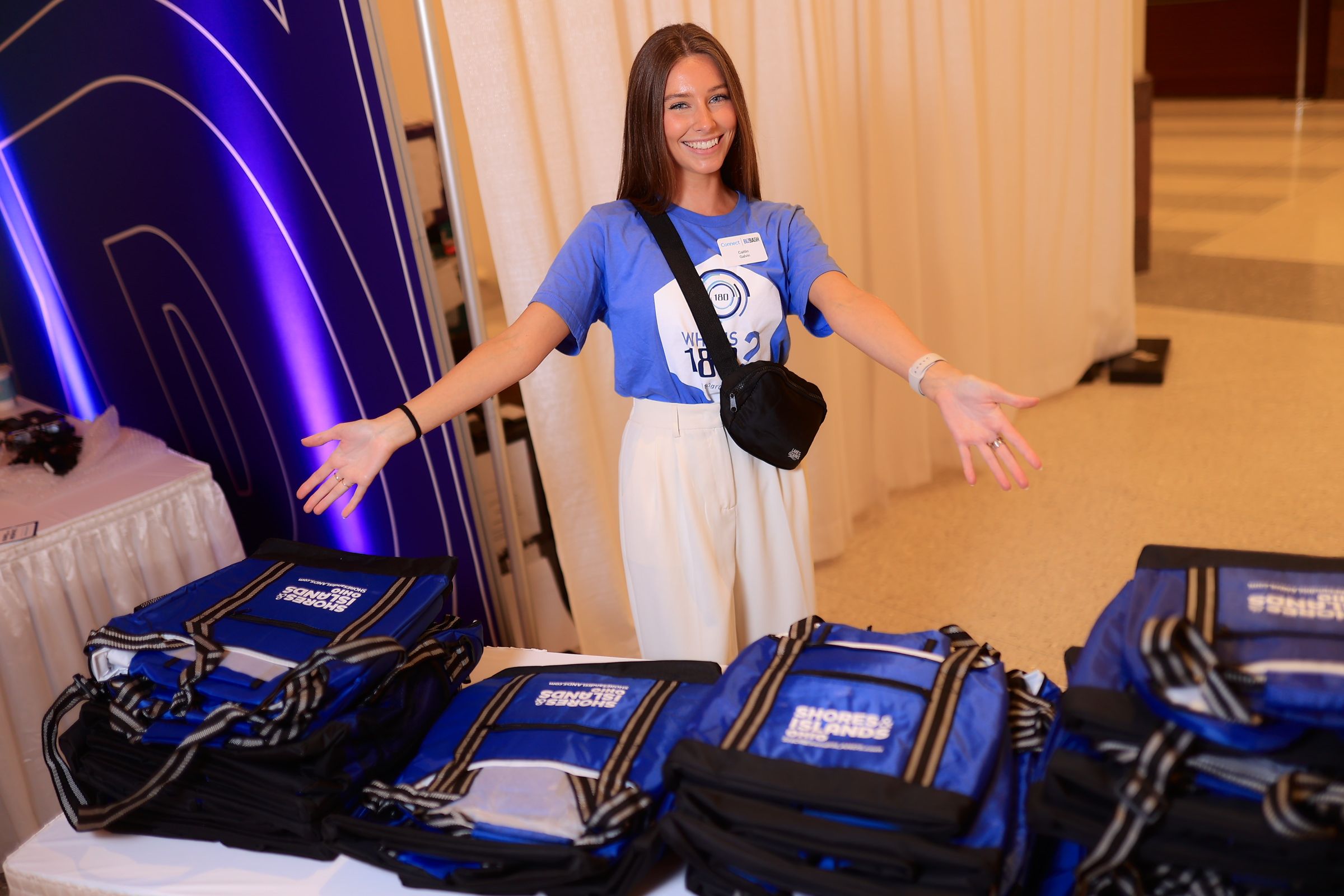 Connect staff member distributing reusable bags
