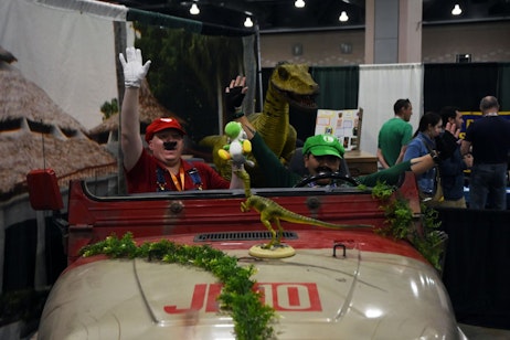 Mario and Luigi Cosplayers in a Jurassic Parks Jeep
