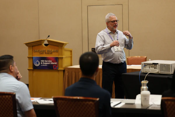 Instructor Doug Tedder leads a classroom session for the HDI Support Center Manager course, presenting leadership concepts to attendees.