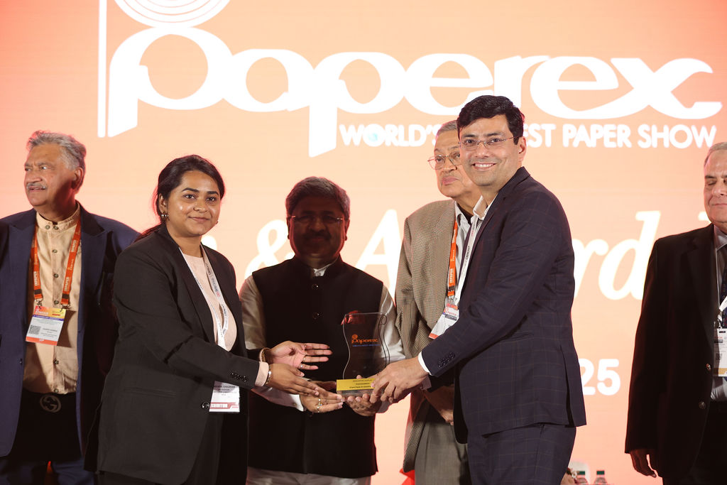 Group of people celebrating after winning an award.