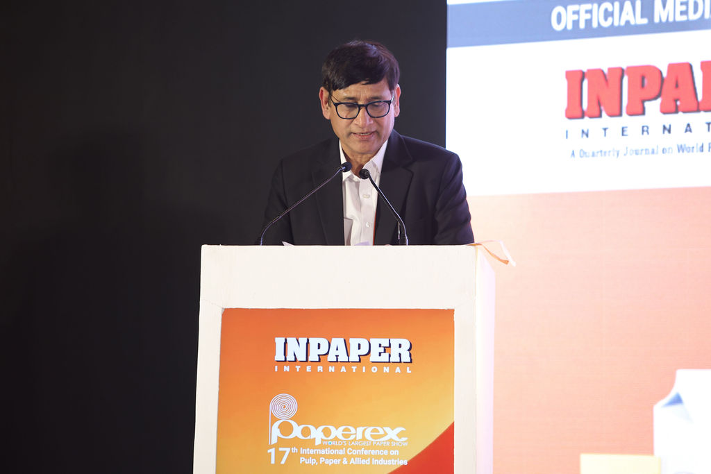 Person speaking at a podium during the award ceremony.