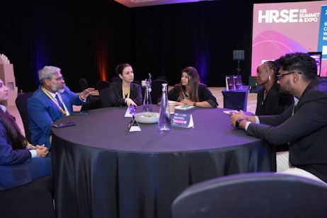 Group discussion at HRSE Dubai 2025 workshops, where HR professionals explore AI, leadership training, and certified HR learning pathways.