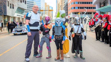 A group of Star Wars cosplayers smile and pose during the Parade of Wonders.