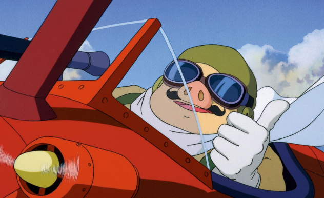 Flying a red, single-pig plane, Porco sits, smiling, and giving a thumbs up with a white gloved hand. He wears a green helmet and black goggles, and has a small black handlebar moustache. 
