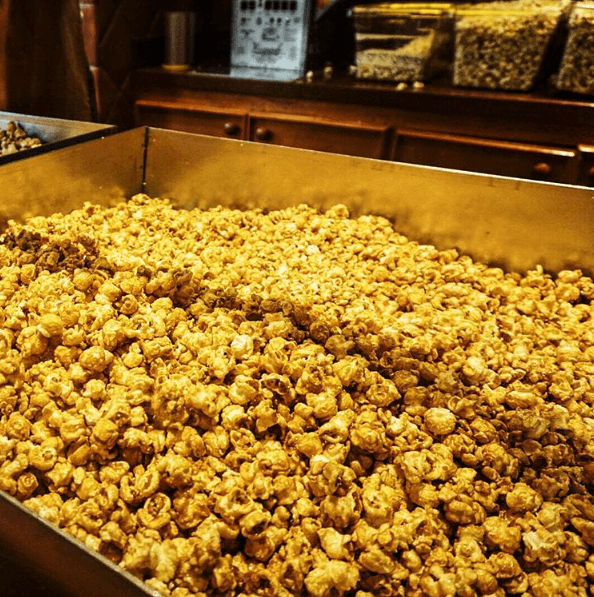 A fresh batch of golden caramel corn is in the basin ready for park goers to order.