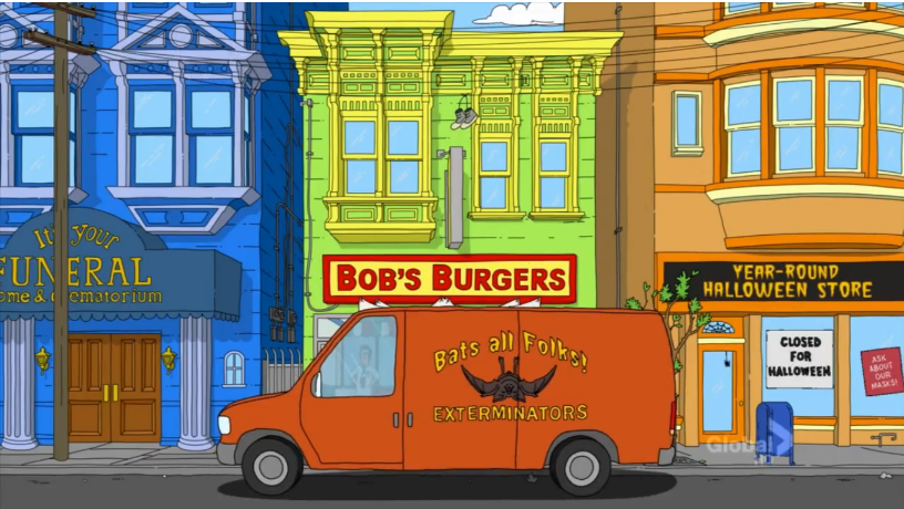A view of Ocean Avenue. "Bats all Folks!" Exterminator van in front of Bob's Burgers, which is nestled between "It's Your Funeral" funeral home and crematorium and the Year-Round Halloween Store. The Halloween store has 2 signs in the window, one says "Ask about our masks" the other, "closed for Halloween"