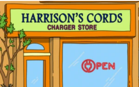A green sign on the storefront reading "Harrison's Chords Charger Store", the Open sign illuminated in the window. the O in open is a 2-prong electrical plug