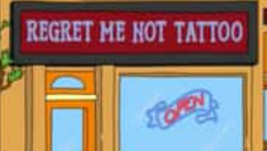 The dark sign is brightened by its bright blue lettering reading "REGRET ME NOT TATTOO" the Open sign looks like a tattoo banner that reads "OPEN"