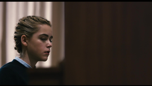 a woeful Kat sits at the dining room table of her school's boarding house. Her family has not arrived to retrieve her for winter break. This begins her decent into demon born sickness. to the right of the image is Kat, the rest is a shot coming past the open doorway