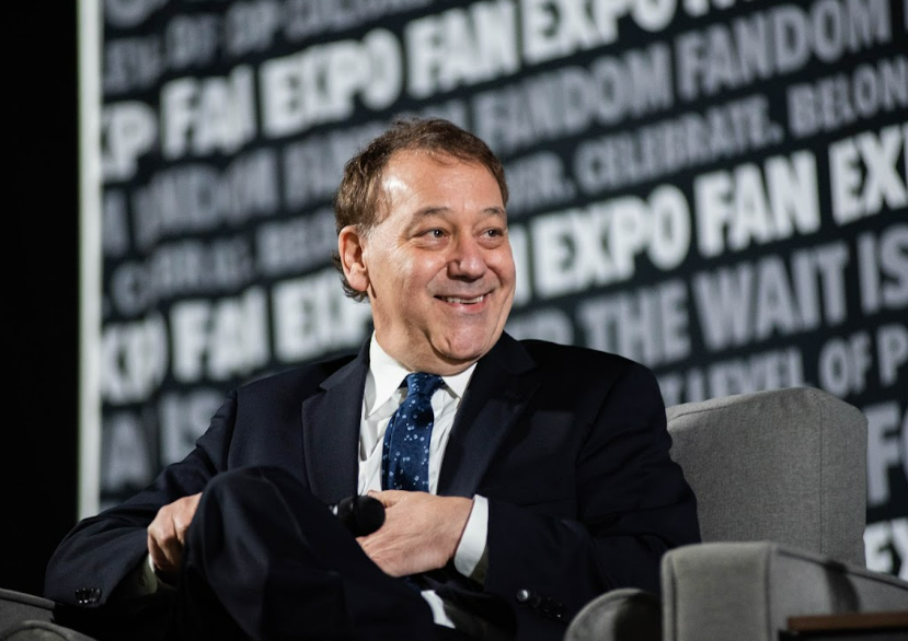 Sam Raimi listens intently as the moderator facilitates fan questions