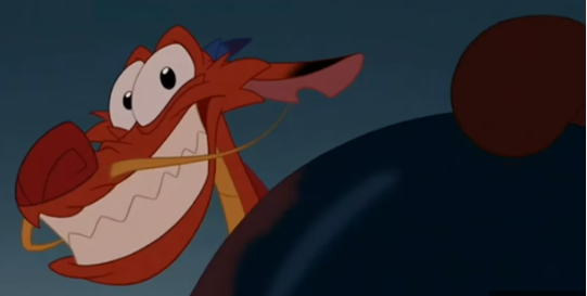 Mushu, the luck dragon, smiles as he pops out from behind a rock