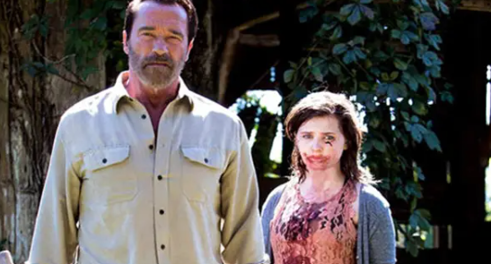 Wade (left) stands in defense of Maggie, who is bloodied from the consumption of another person.